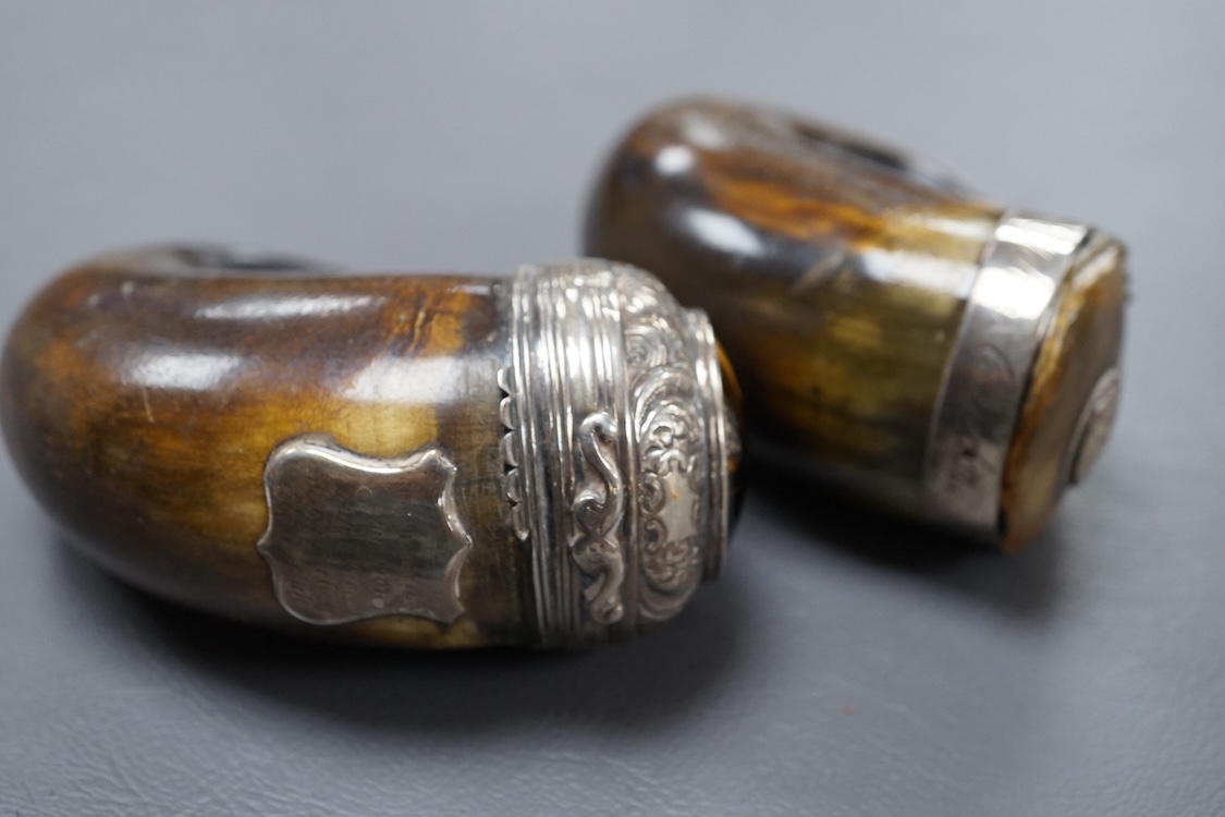Two 19th century white metal mounted horn snuff mulls, one engraved 'John Calder', the other with inset tiger's eye quartz cabochon, both a.f., largest 83mm.